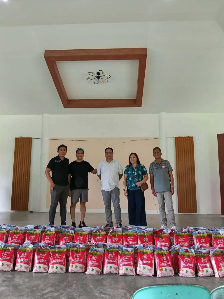 Zeta Elite School of Nursing alumni representatives with bags of rice prepared for working students