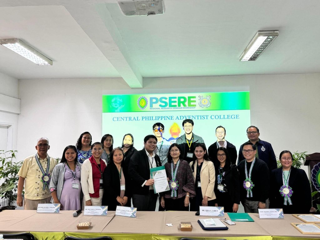 CPAC faculty with PSERE seminar speakers and guests at the Regional Research Seminar-Workshop, Central Philippine Adventist College on screen
