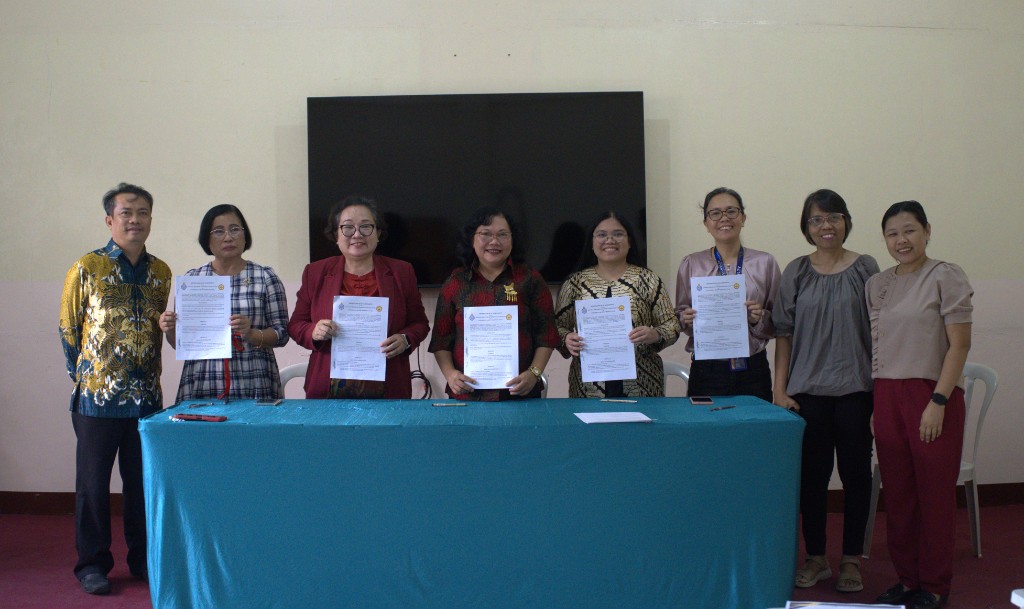CPAC administrators and partner university representatives hold signed Memoranda of Agreement at the CPAC campus